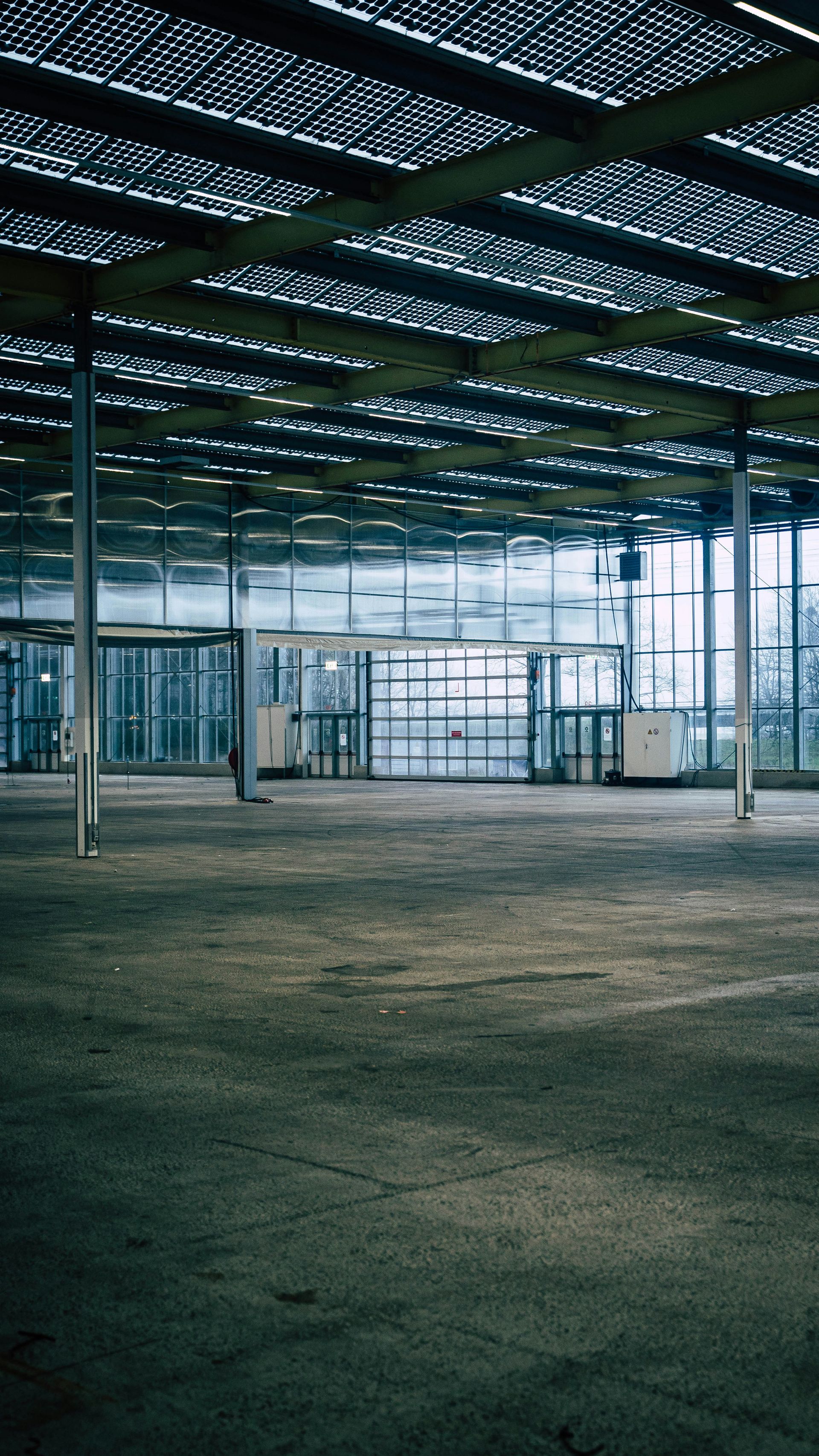an empty parking garage with a lot of windows